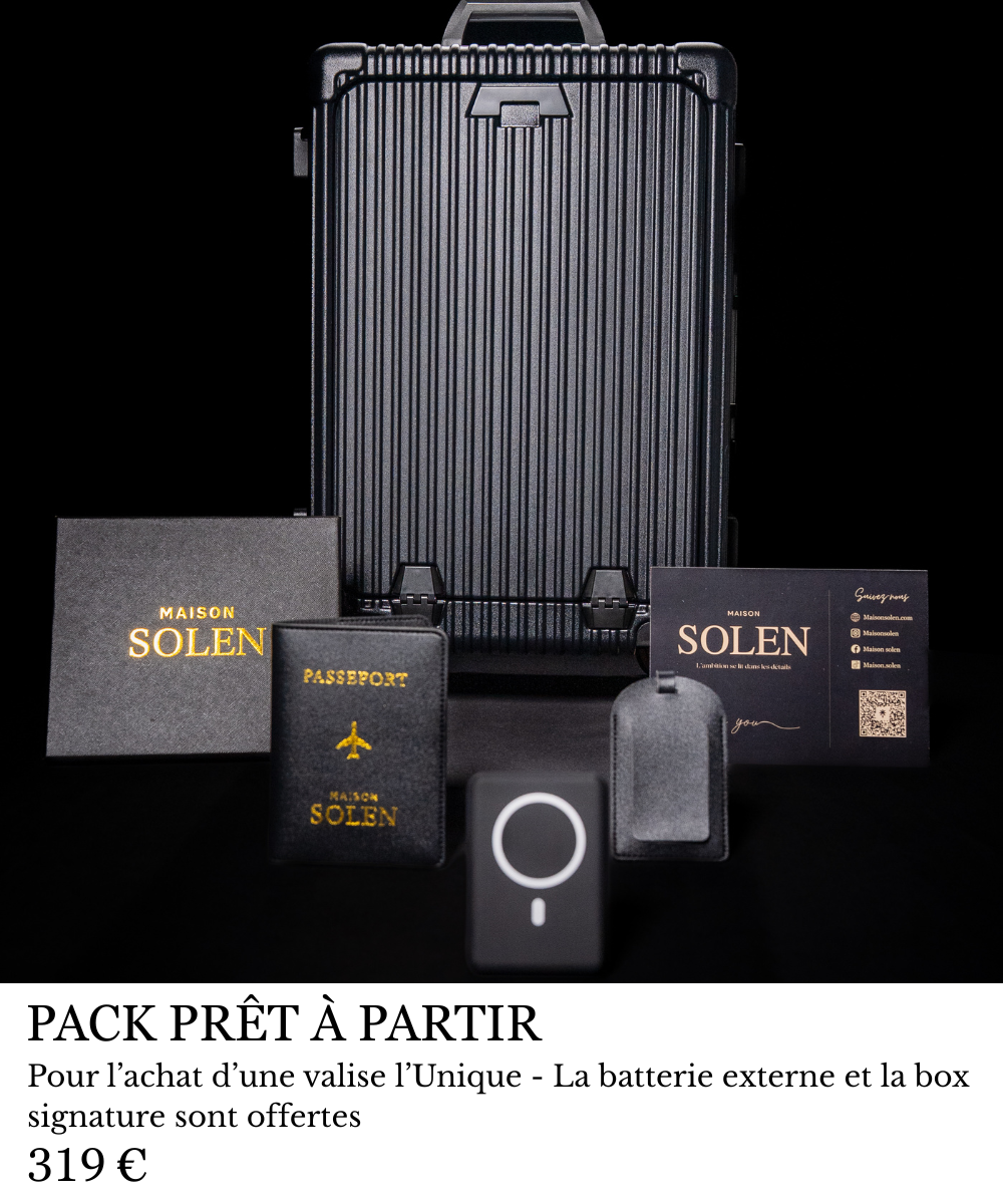 Valise cabine premium Maison Solen en aluminium noir présentée avec roues siglées S, batterie MagSafe externe et box signature de luxe, au prix de 319 euros.